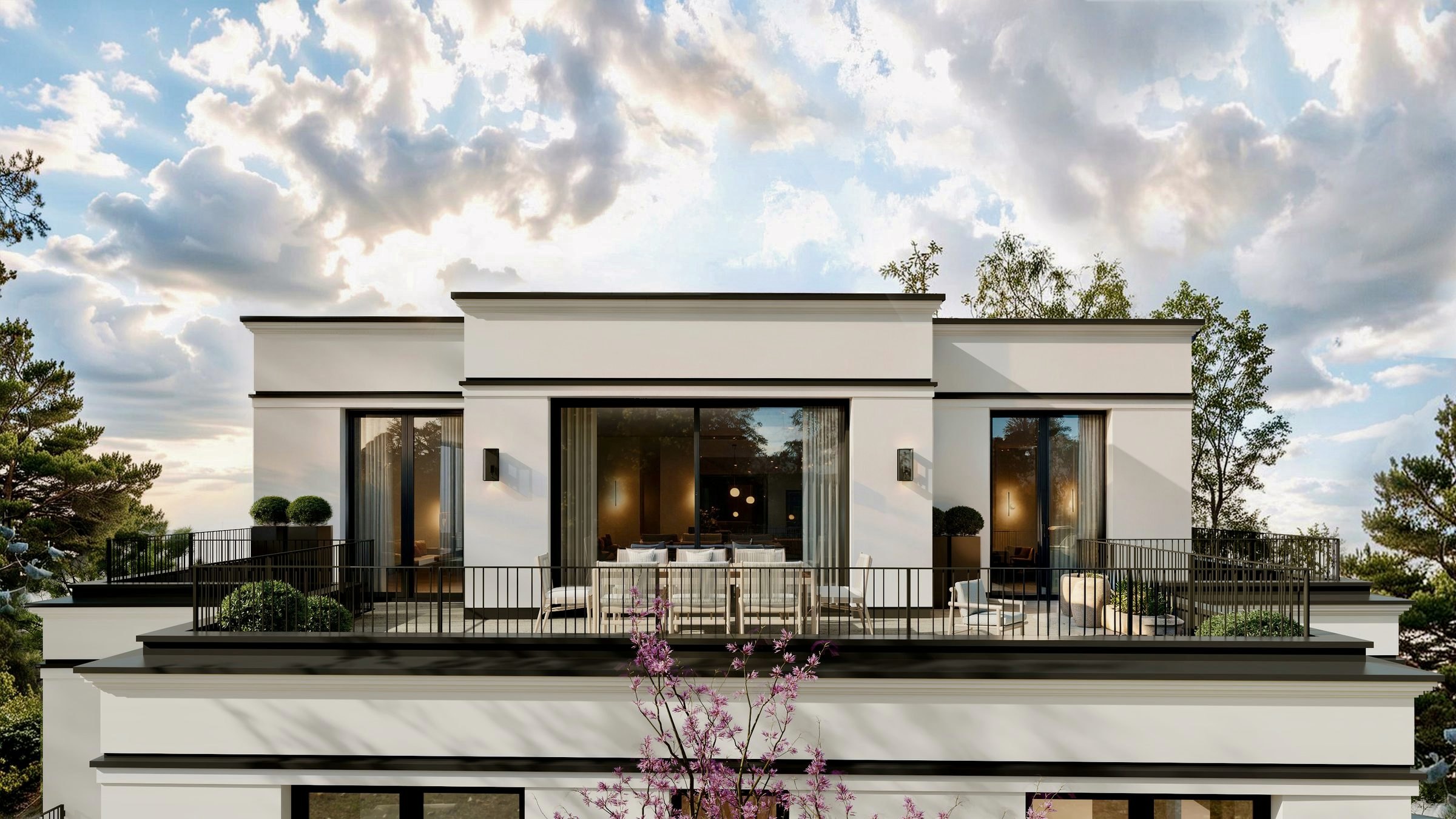 Penthouse mit Dachterrasse, bodentiefen Fenstern und gedecktem Tisch im Abendlicht